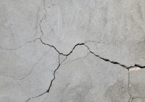 cracked-concrete-wall-covered-gray-600nw-2303457175