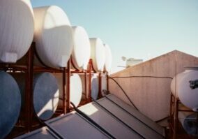 Commercial water heaters in a modern facility mechanical room